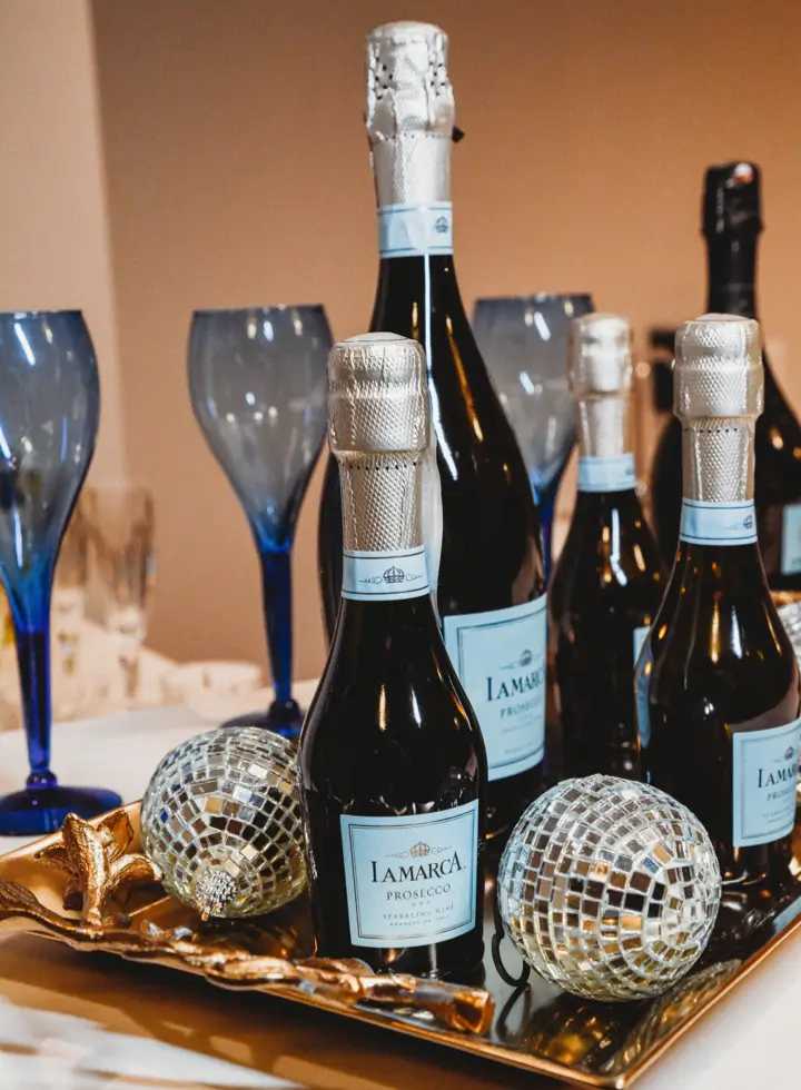 A few bottles of prosecco and champagne flutes on the concession stand bar at the Dawn Theater