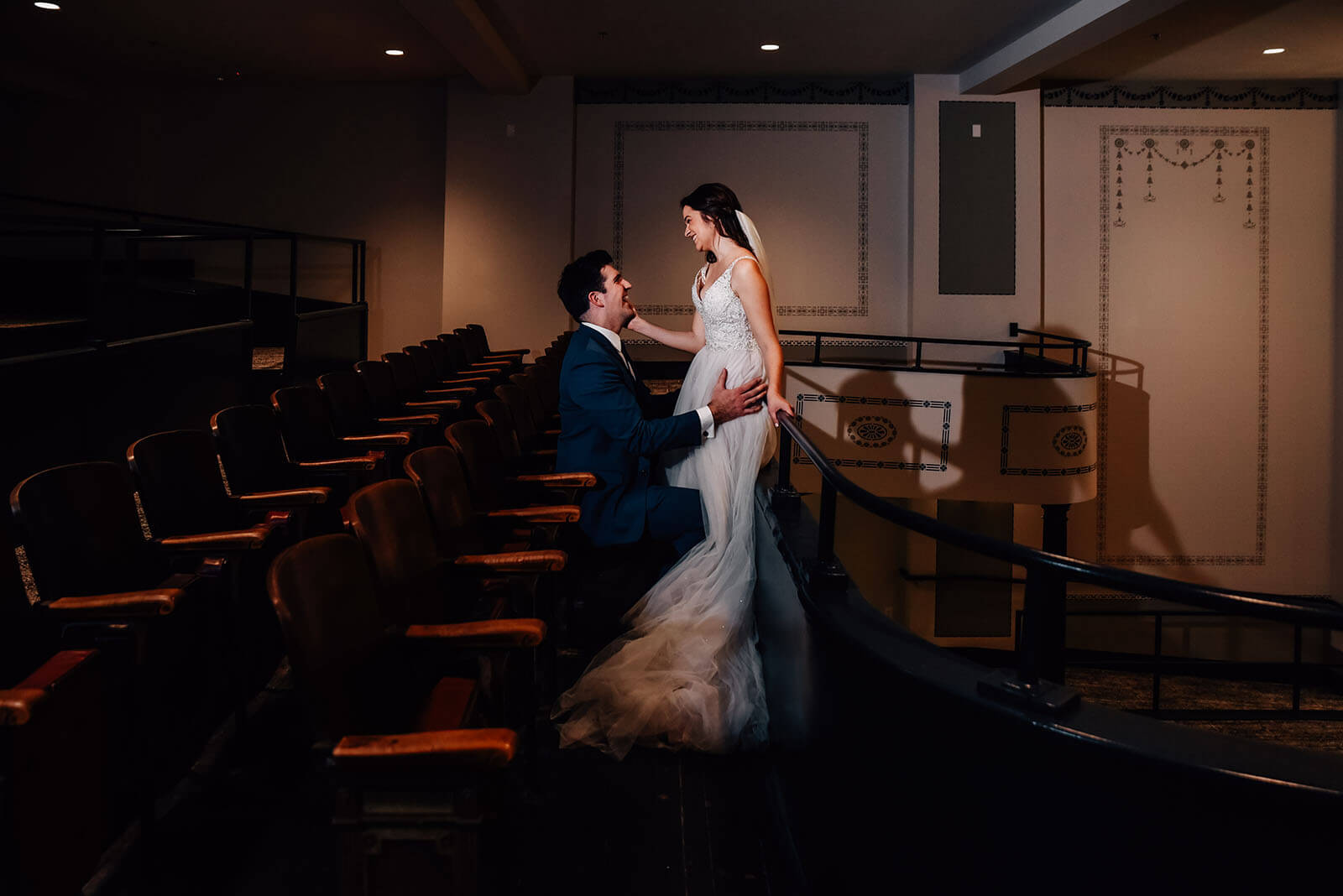 Bride and groom sharing a moment in the balcony of the Dawn Theater